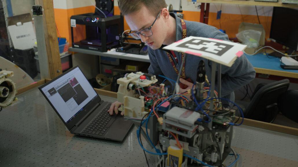 student working on a robot