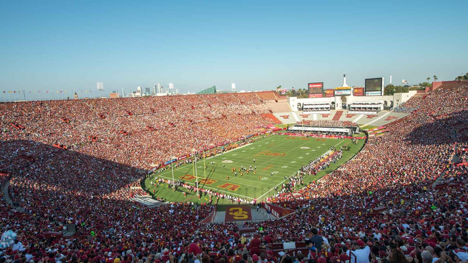 the LA Memorial Coliseum football field seen from a distance