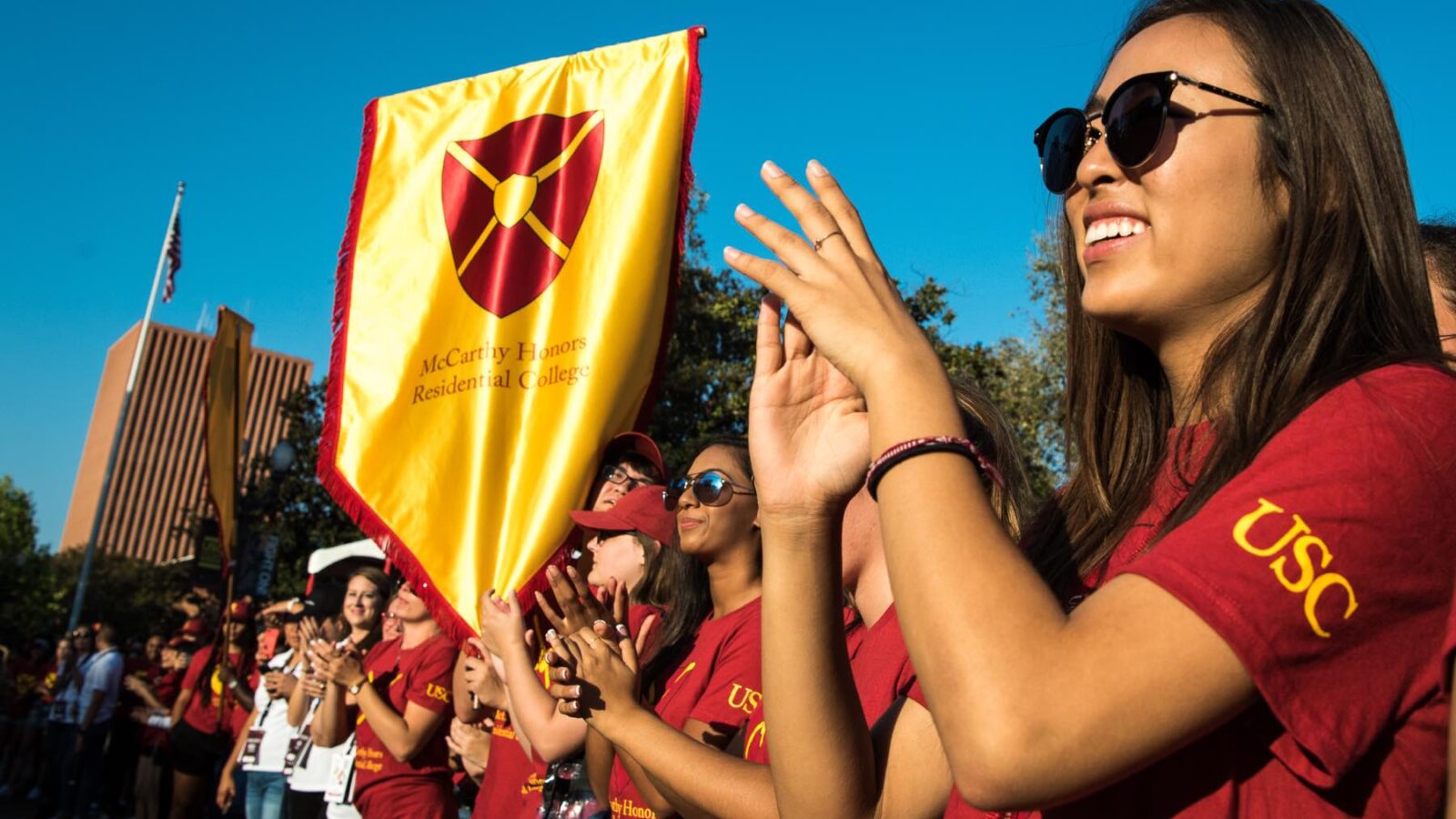 students cheer at a convocation event