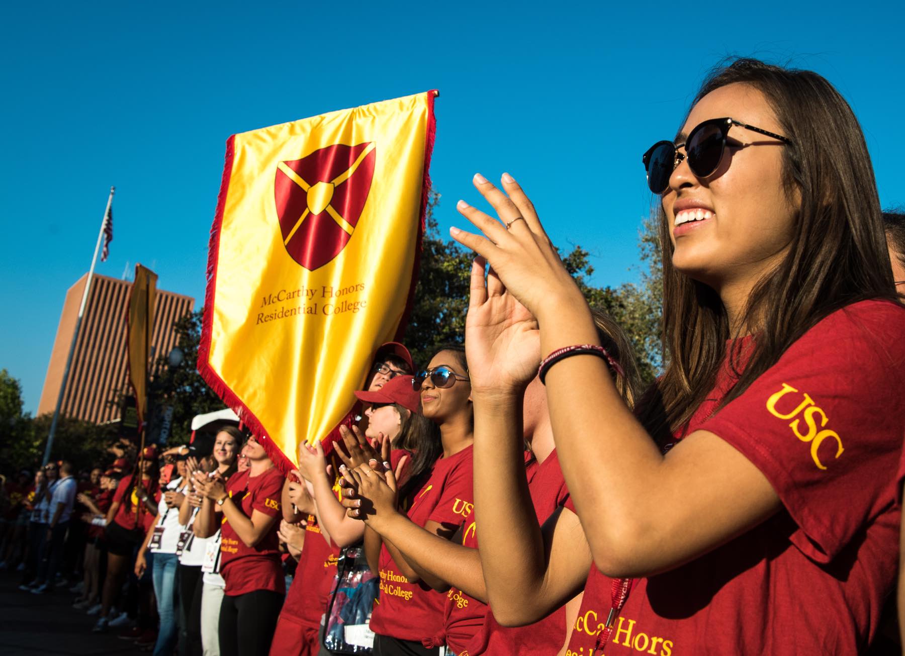 students cheer at a convocation event