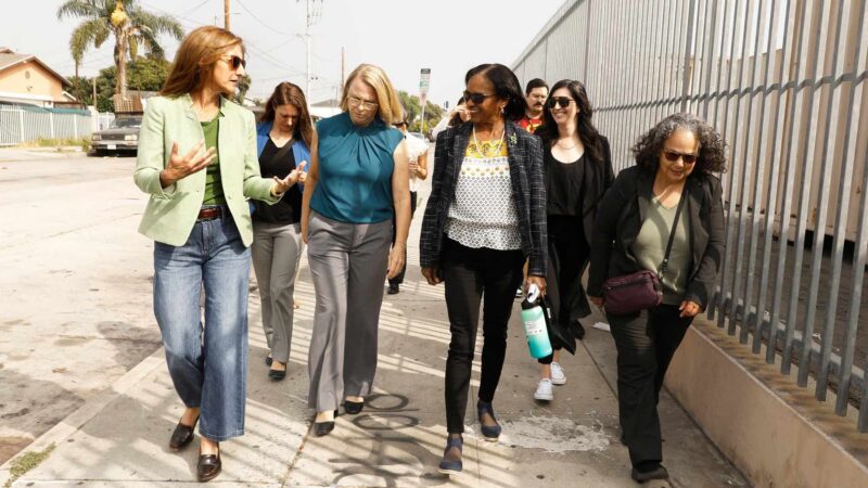 women walk down a Los Angeles sidewalk